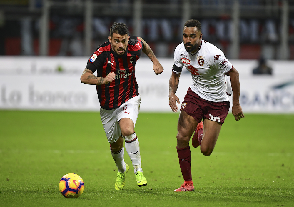 AC Milanu00e2u20acu2122s Spanish forward Suso runs for the ball with Torinou00e2u20acu2122s French defender Koffi Djidji during their Serie A match in Milan December 9, 2018. u00e2u20acu201d AFP pic