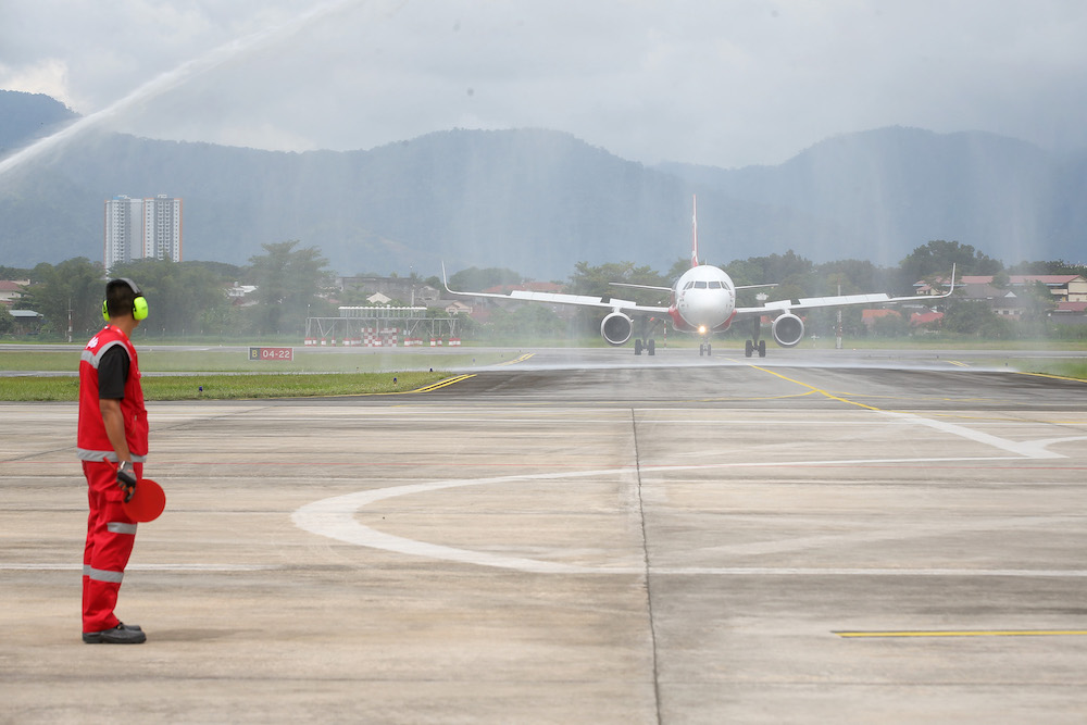 The inaugural AirAsia flight from Singapore arrived at Sultan Azlan Shah Airport in Ipoh at 1.00pm. u00e2u20acu201d Picture by Marcus Pheong