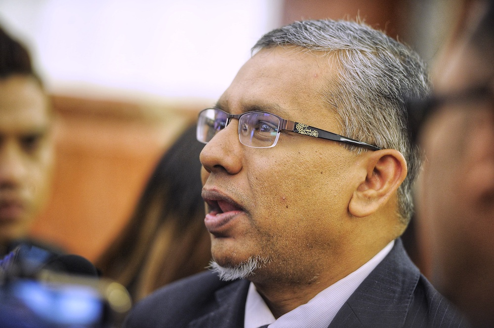 Deputy Minister in the Prime Ministeru00e2u20acu2122s Department Mohamed Hanipa Maidin speaks to the media at the Parliament lobby, December 5, 2018. u00e2u20acu201d Picture by Shafwan Zaidon