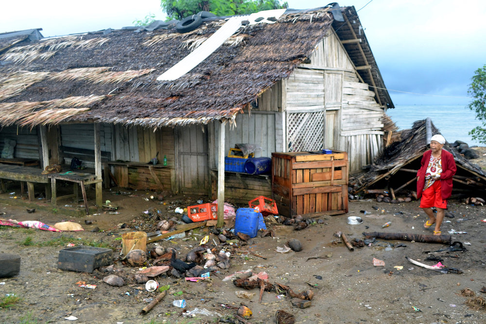 A local walks near her damaged house hit by tsunami at Tanjung Lesung district in Pandeglang, Banten province, Indonesia, December 23, 2018. u00e2u20acu201d Antara Foto pic via Reuters