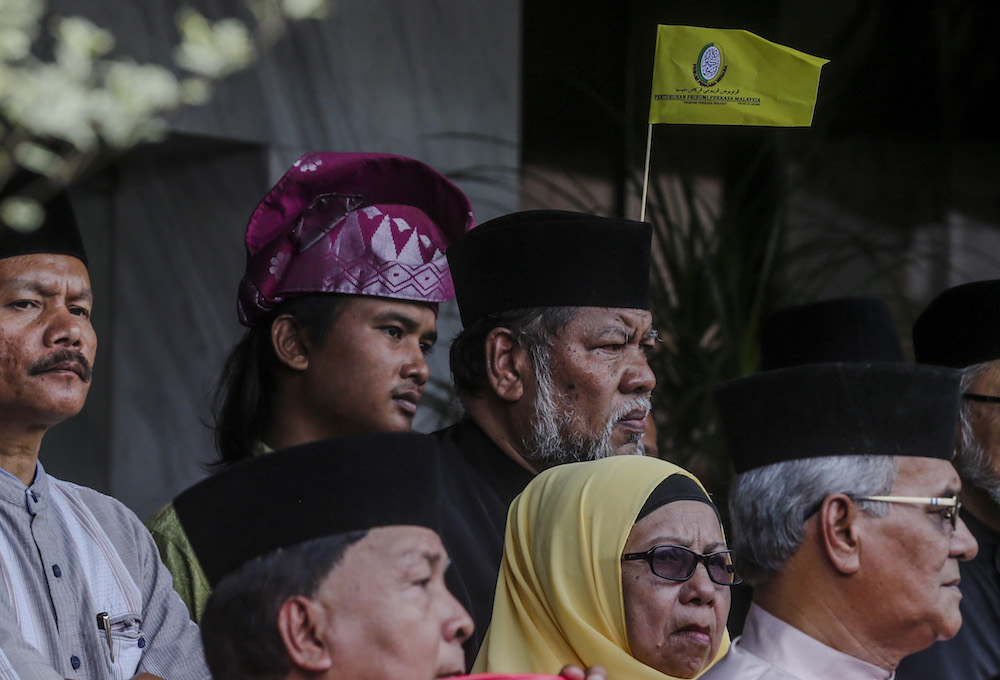 Participants react during the 'Himpunan Jihad Perkasa' rally in Kampung Baru, Kuala Lumpur December 2, 2018. — Picture by Firdaus Latif