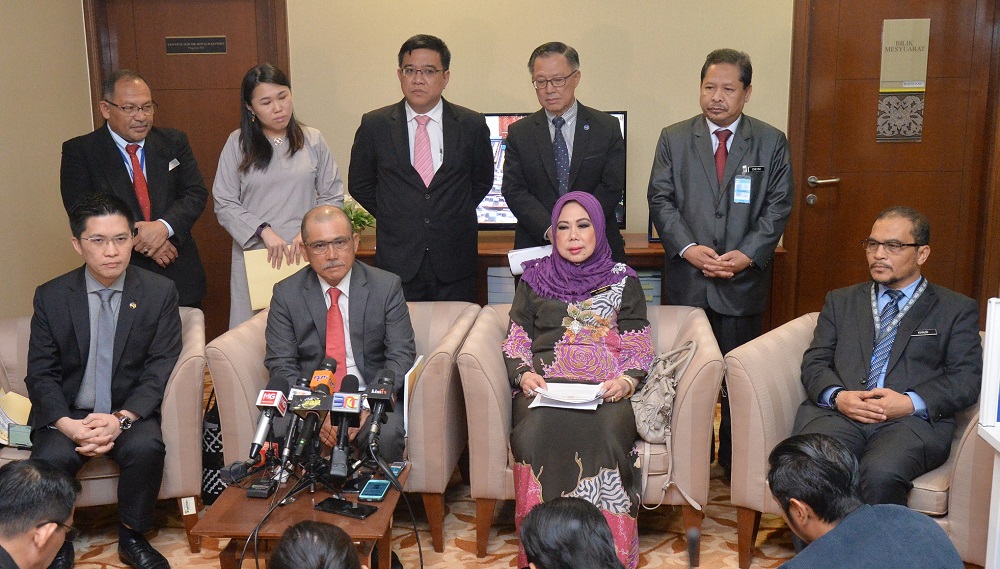 PAC chairman Datuk Seri Ronald Kiandee (seated, second left) and Auditor-General Tan Sri Madinah Mohamad (seated, second right) during a press conference in Parliament, Kuala Lumpur December 3, 2018. u00e2u20acu201d Picture by Razak Ghazal