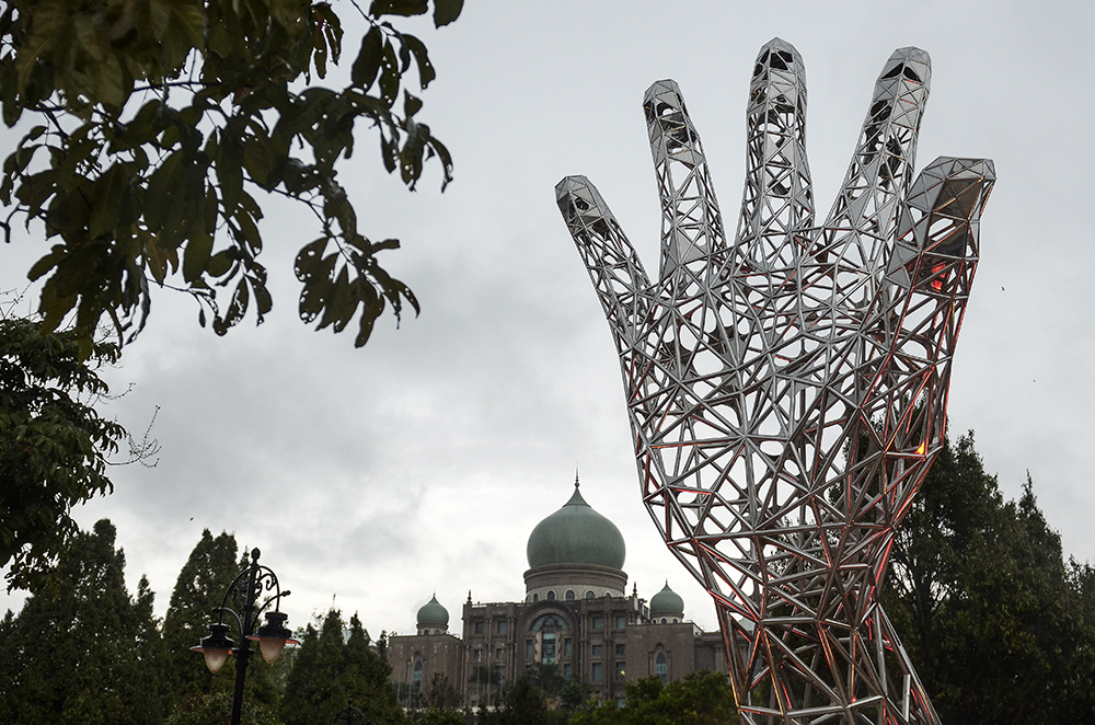 The 12-metre steel monument in Dataran Putra that symbolises the solidarity of every nation in combating corruption. — Picture by Miera Zulyana