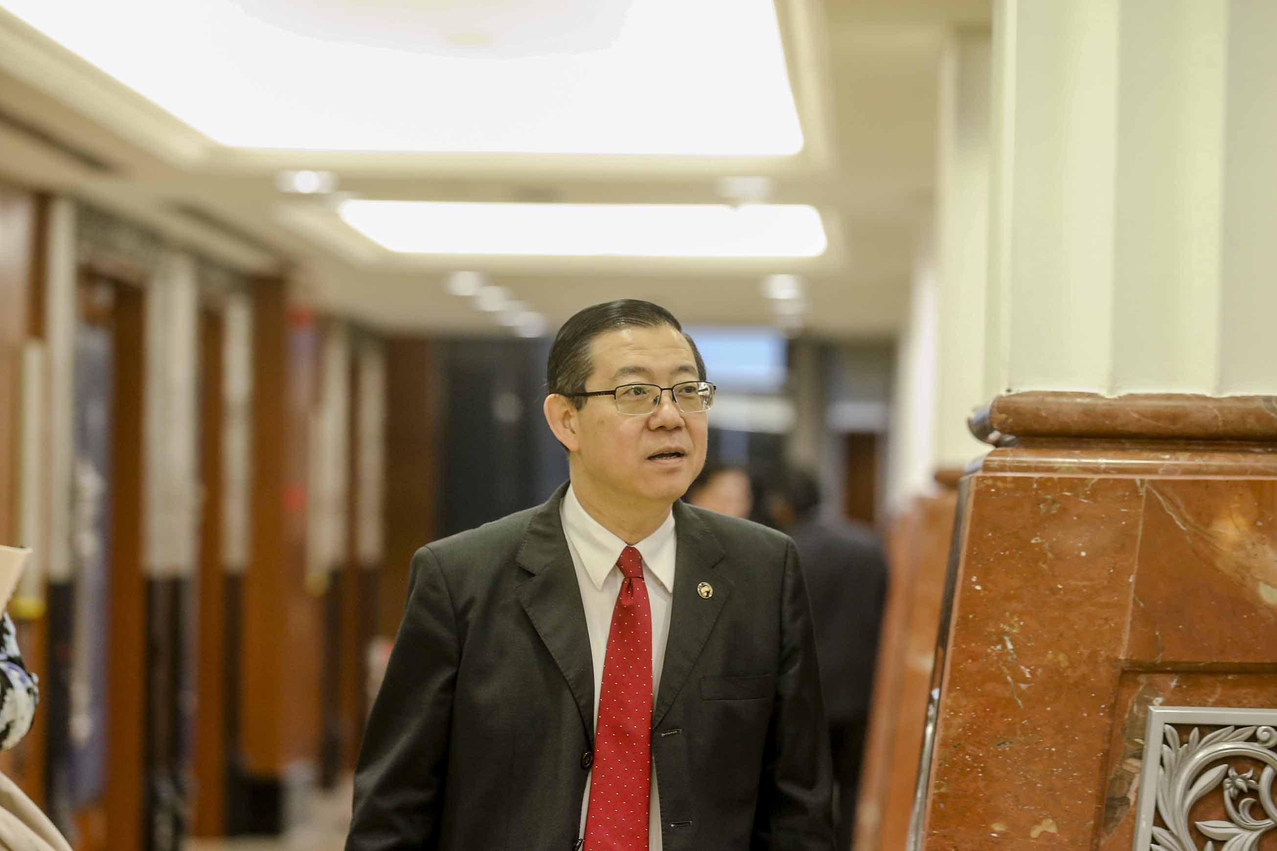 Lim Guan Eng speaks to reporters in Parliament December 10, 2018. u00e2u20acu201d Picture by Firdaus Latif