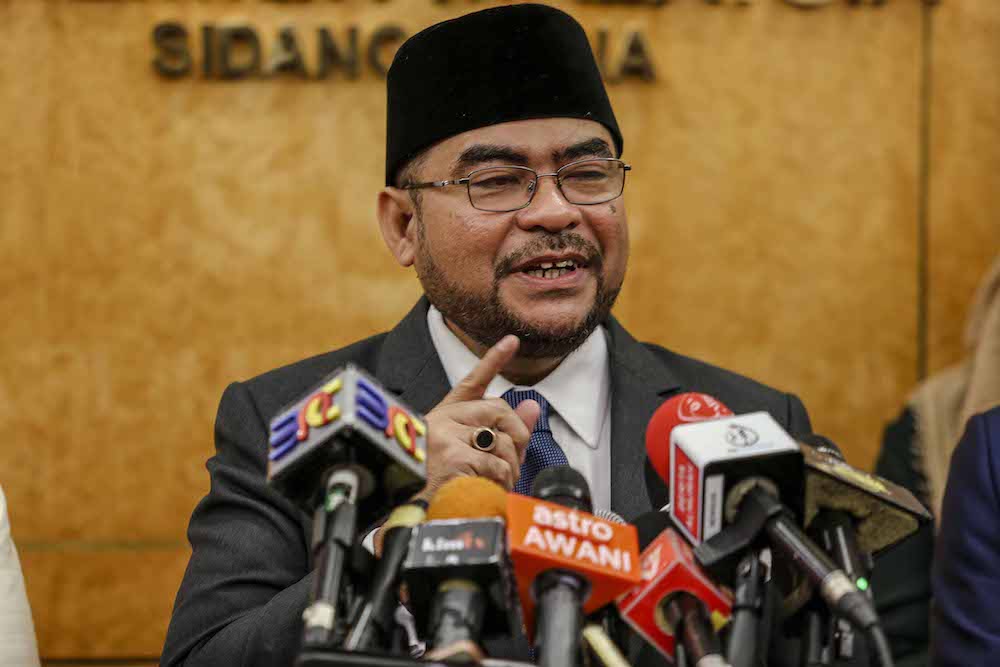 Minister in the Prime Ministeru00e2u20acu2122s Department Datuk Seri Mujahid Yusof Rawa speaks to reporters in Parliament December 10, 2018. u00e2u20acu201d Picture by Firdaus Latif
