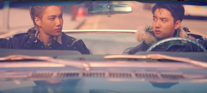 A screen capture of the music video showing Kai (left) and D.O.