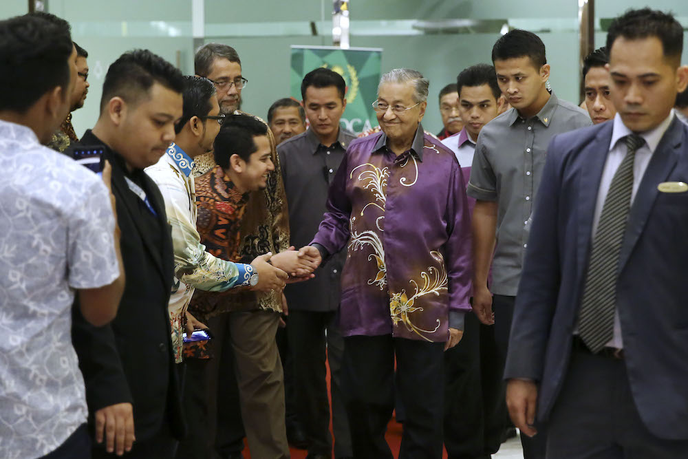 Tun Dr Mahathir Mohamad shakes hands with guests during Sultan Abdul Hamid Collegeu00e2u20acu2122s (SAHC) annual dinner in Kuala Lumpur December 21, 2018. u00e2u20acu201d Picture by Yusof Mat Isa