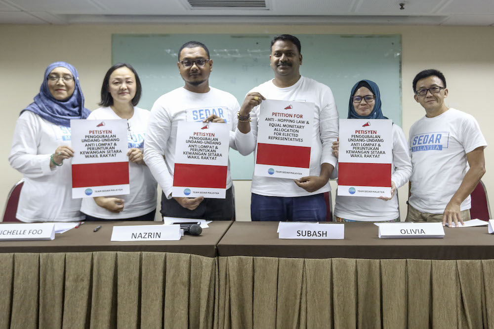 SEDAR Malaysia chairman, Nazrin Noraini (3rd left) and other members pose for a group photo after the news conference at Wisma MCA in Kuala Lumpur December 28, 2018. u00e2u20acu201d Picture by Yusof Mat Isa