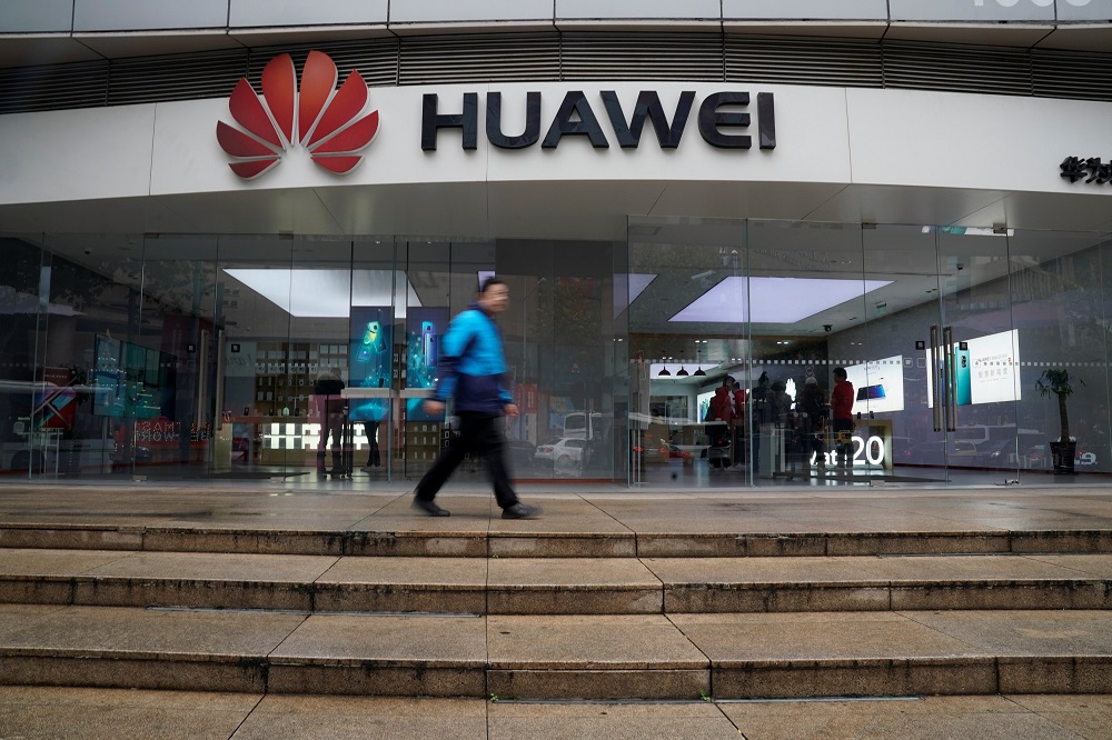 A man walks by a Huawei logo at a shopping mall in Shanghai, China December 6, 2018. u00e2u20acu201d Reuters pic
