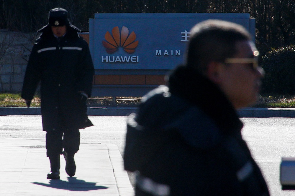 Security officers guard the gate to the compound of the Huawei office in Beijing, December 6, 2018. u00e2u20acu201d Reuters pic