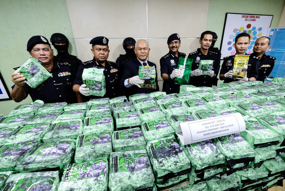 Director of the Bukit Aman Narcotics Criminal Investigation Department director Datuk Seri Mohmad Salleh poses for pictures with the seized drugs in Kampar December 6, 2018. u00e2u20acu201d Bernama pic