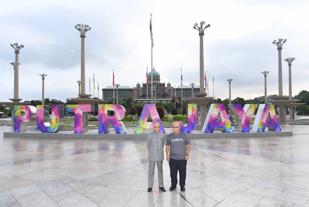 Tun Dr Mahathir Mohamad and Putrajaya Corporation (PPj) president Datuk Aminuddin Hassim stand in front of the u00e2u20acu02dcPutrajayau00e2u20acu2122 signage in Dataran Putra, Putrajaya December 31, 2018. u00e2u20acu201d Bernama pic