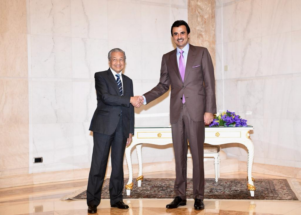 Tun Dr Mahathir Mohamad greets the Emir of Qatar Sheikh Tamim Hamad Al Thani in Putrajaya December 6, 2018. u00e2u20acu201d Picture via Twitter