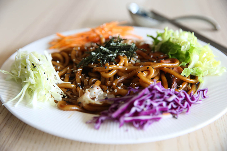 Their Radiant Fried Light Udon is served with an assortment of vegetables and mushrooms that makes it a light, tasty meal