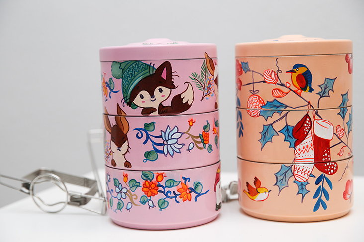 Whimsical designs with rabbits and robins give a modern twist to these decorative painted tiffins
