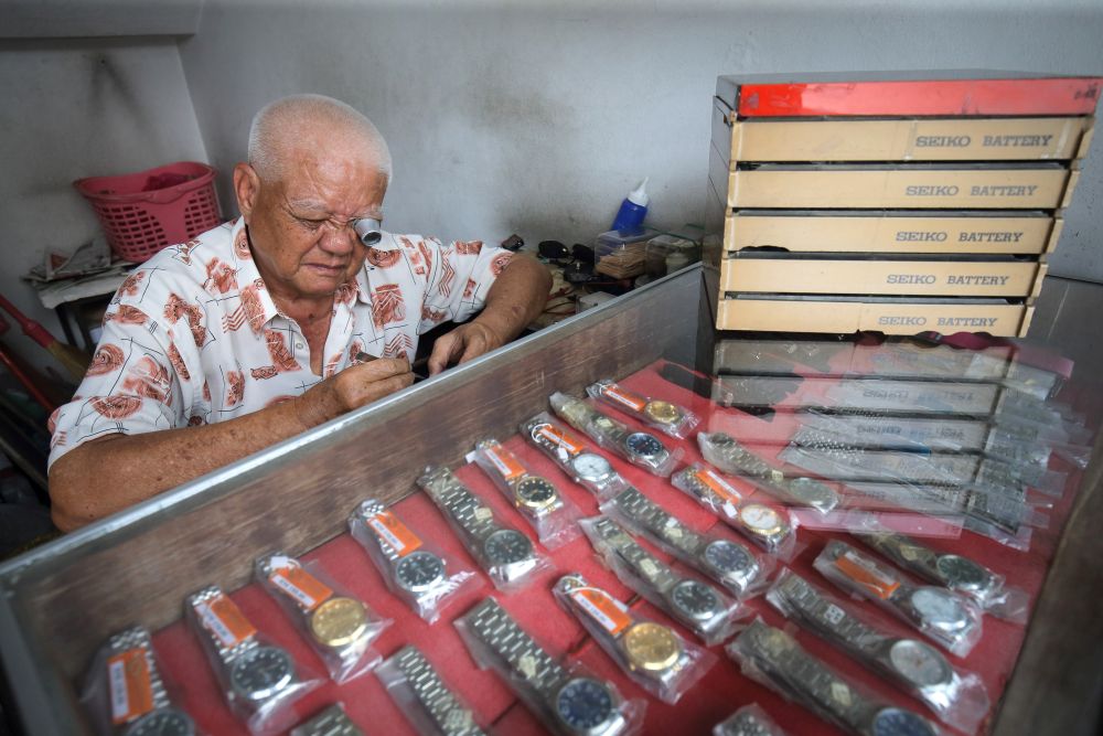 Wong Hean Seng has been a watchmaker for 62 years. u00e2u20acu201d Picture by Marcus Pheong