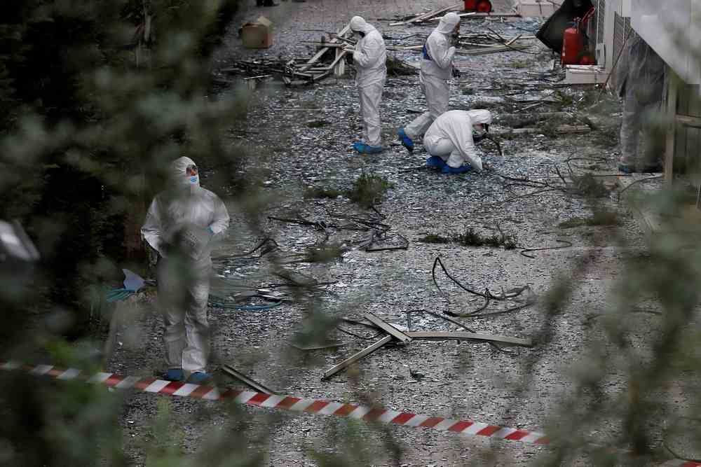Forensic experts search for evidence after a bomb blast outside the Greek SKAI TV building in Athens, Greece December 17, 2018. Another explosion in Athens went off early December 27, 2018. u00e2u20acu201d Reuters pic