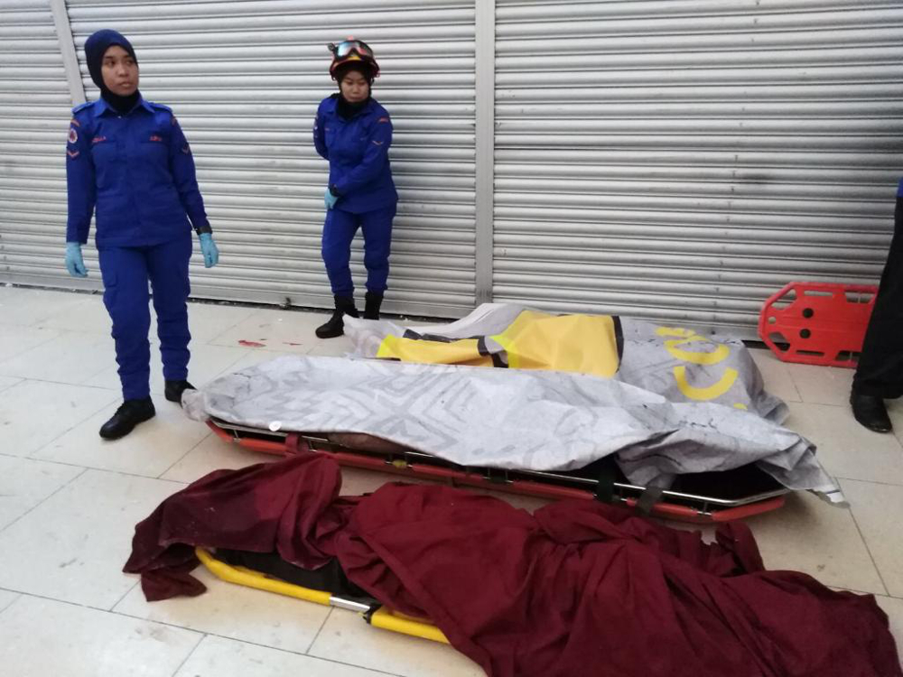 The bodies of three victims are seen at the City One Megamall in Kuching after an explosion December 4, 2018. — Picture by Sarawak State Disaster Management Committee