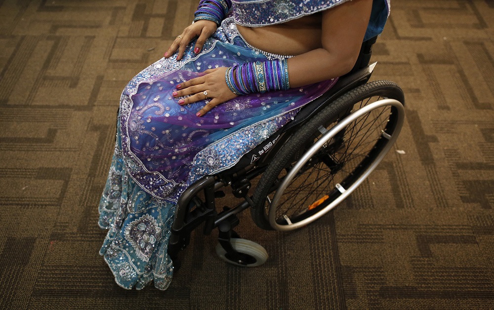 A competitor waits backstage during Miss Wheelchair India, the countryu00e2u20acu2122s first wheelchair beauty pageant, in Mumbai November 24, 2013. u00e2u20acu201d Reuters pic         