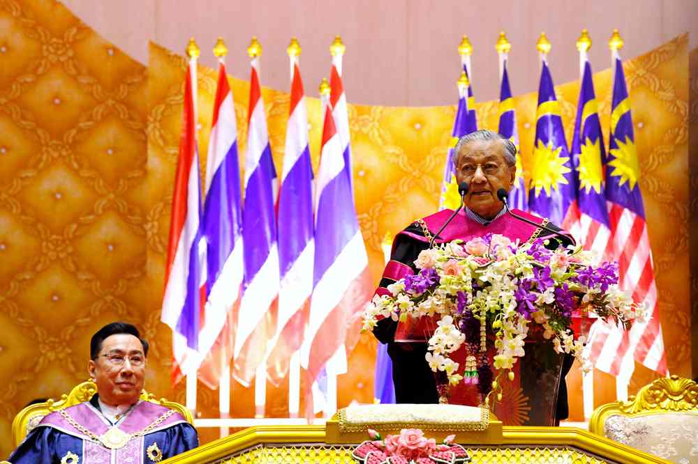 Prime Minister Tun Dr Mahathir Mohamad (right) receives the honorary doctorate at Bangkok's Rangsit University December 16, 2018. u00e2u20acu201d Bernama pic