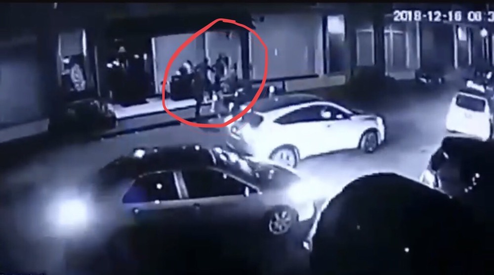 The suspects (circled in red) seen slashing the victim Edward Rishal S. Reggie. — Screenshot from CCTV