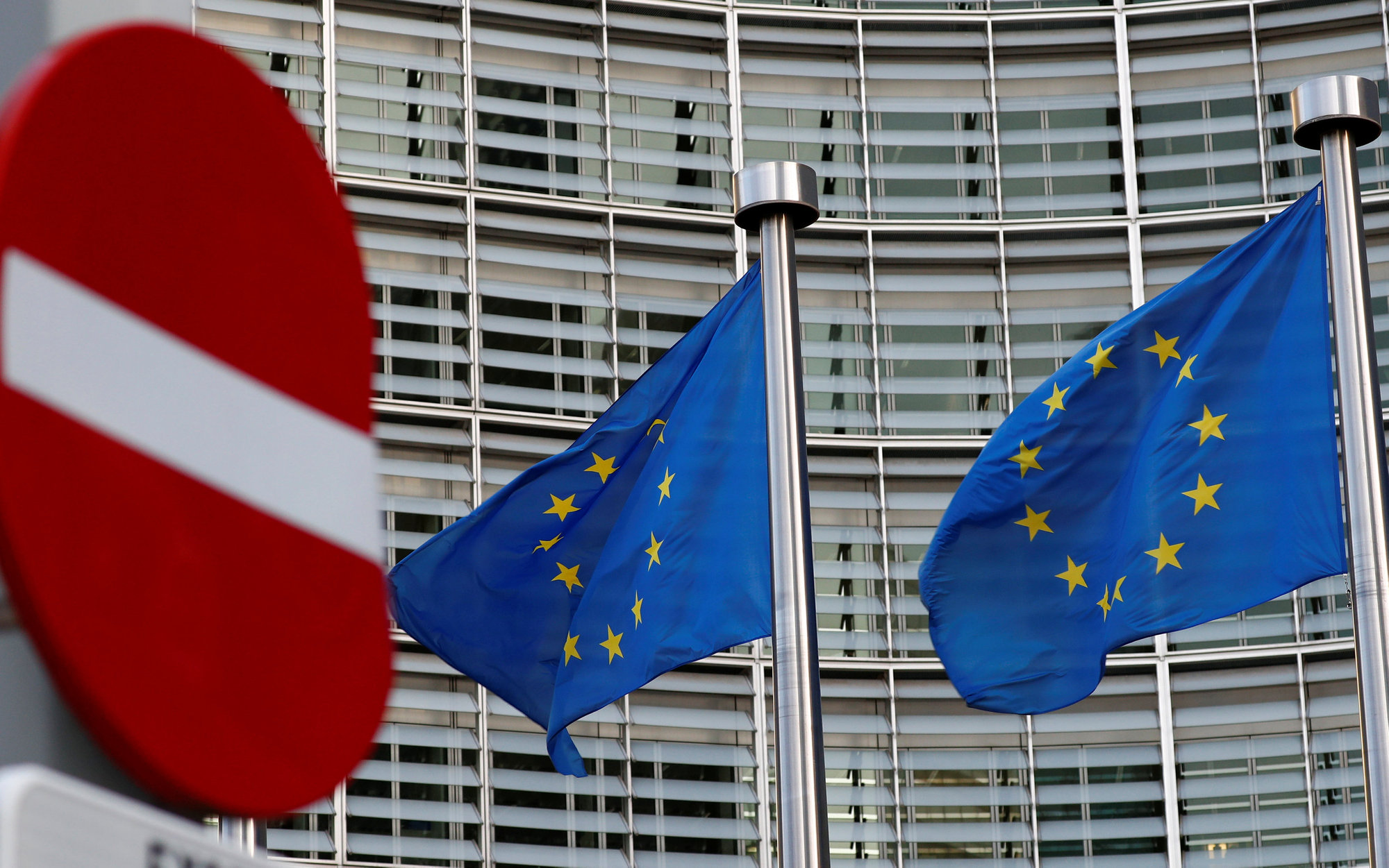 A street sign is seen near European Union flags outside the EU Commission headquarters in Brussels November 14, 2018. u00e2u20acu201d Reuters pic