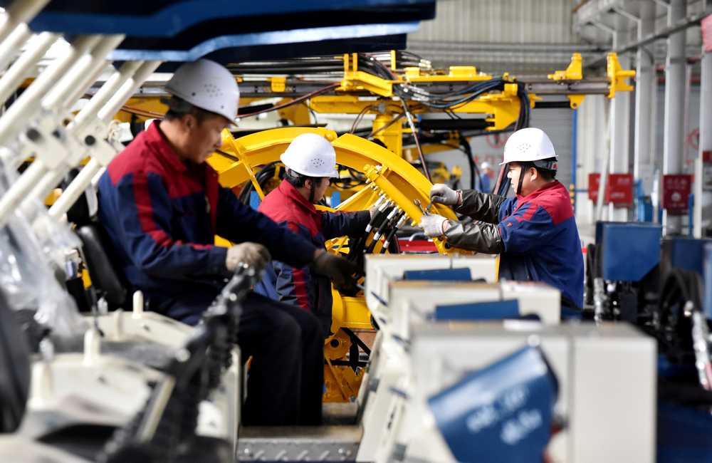 Employees work on a drilling machine production line at a factory in Zhangjiakou, Hebei province, China November 14, 2018. u00e2u20acu201d Reuters pic