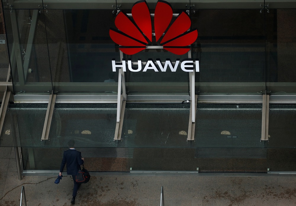 A man walks into the offices of telecommunications company Huawei in Auckland, New Zealand, October 30, 2018. u00e2u20acu201d Reuters pic
