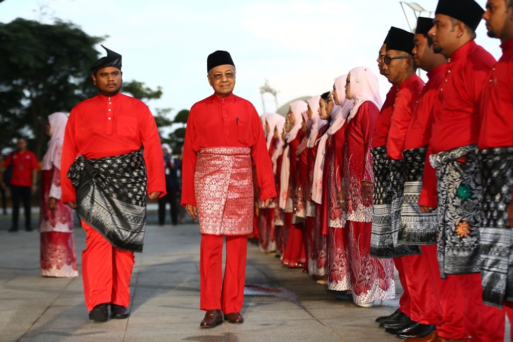 PPBM chairman Tun Dr Mahathir Mohamad inspects honour guards consisting of 100 party members on the last day of the annual general assembly in Putrajaya December 30, 2018. u00e2u20acu2022 Picture by Ahmad Zamzahuri