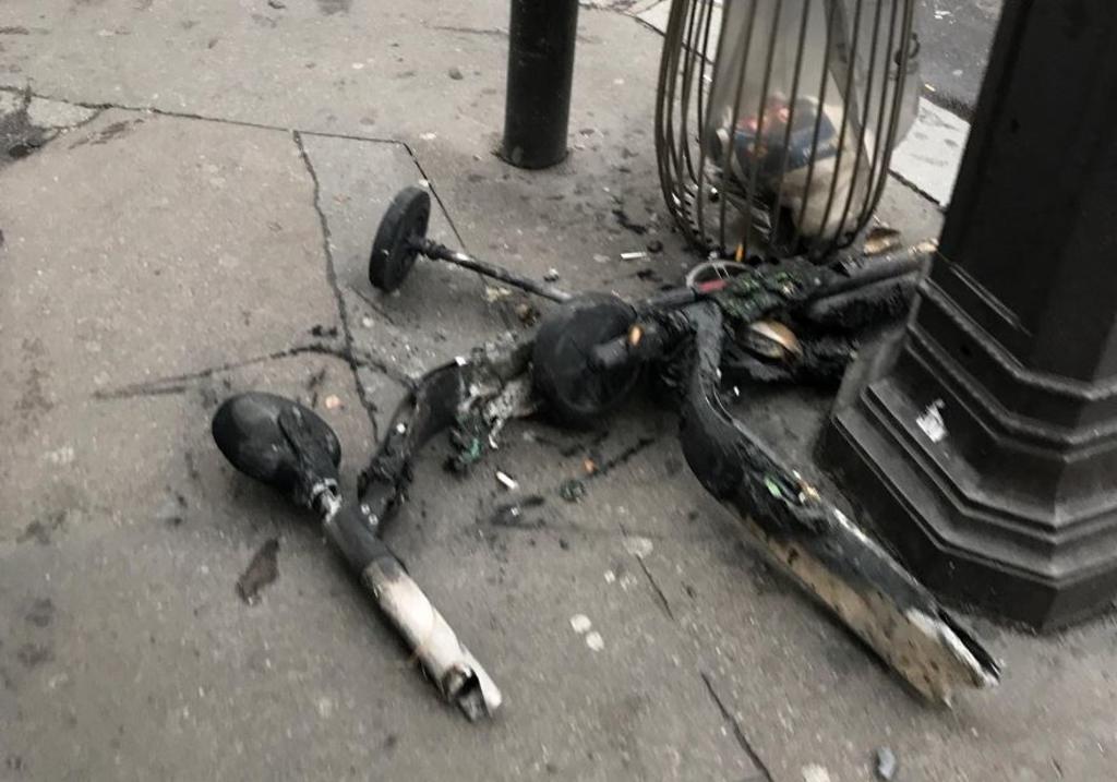 A burnt scooter is seen on the street in the aftermath of the violent protests over the weekend in Paris, France. u00e2u20acu201d Picture courtesy of Ryan Teo 