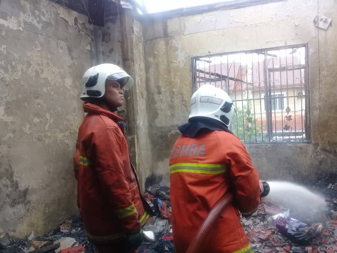 Firemen dousing the flames inside the house in Seri Kembangan December 18, 2018. u00e2u20acu2022 Picture courtesy of the Selangor Fire and Rescue Department