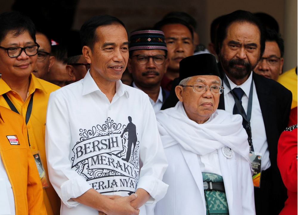 Indonesian President Joko Widodo (left) and his running mate for the 2019 presidential elections Islamic cleric Mau00e2u20acu2122ruf Amin meet supporters in Jakarta, Indonesia, August 10, 2018. u00e2u20acu201d Reuters pic