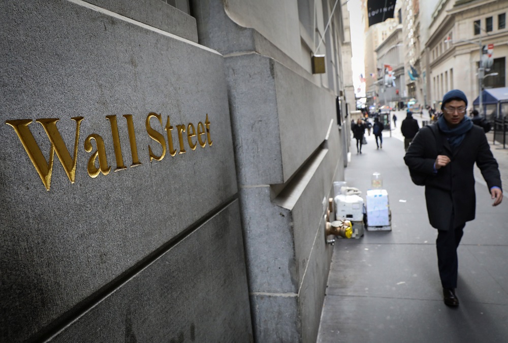 A commuter walks on Wall Street across from the New York Stock Exchange January 10, 2019. u00e2u20acu201d Reuters pic