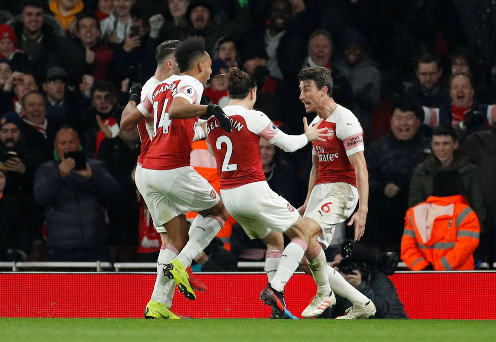 Arsenalu00e2u20acu2122s Laurent Koscielny celebrates scoring their second goal with team mates during their Premier League match with Chelsea at Emirates Stadium in London January 19, 2019. u00e2u20acu201d Action Images pic via Reuters