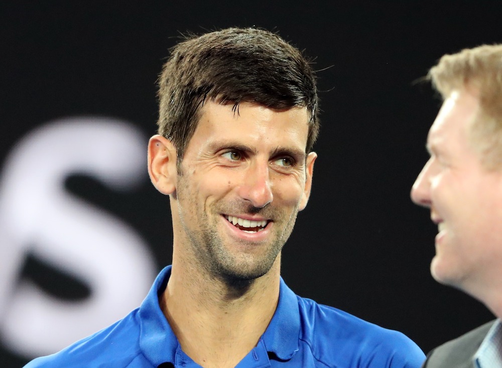 Serbiau00e2u20acu2122s Novak Djokovic smiles during an interview after Japanu00e2u20acu2122s Kei Nishikori retired from their Australian Open quarter-final match in Melbourne January 23, 2019. u00e2u20acu201d Reuters pic