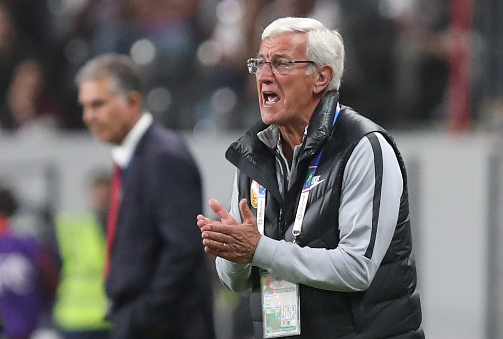 China coach Marcello Lippi (right) and Iran coach Carlos Queiroz during the match at the Mohammed bin Zayed Stadium in Abu Dhabi January 24, 2019. u00e2u20acu201d Reuters pic