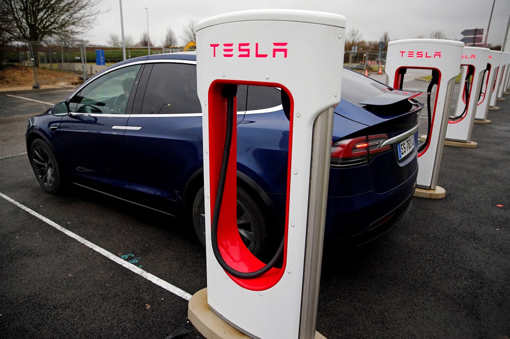 A driver recharges the battery of his Tesla car at a Tesla Super Charging station in a petrol station on the highway in Sailly-Flibeaucourt, France January 12, 2019. u00e2u20acu201d Reuters pic