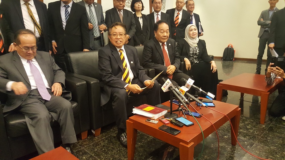 Sarawak Chief Minister Datuk Patinggi Abang Johari Openg (seated, centre) speaking to reporters after chairing the Sarawak Consultative Committee on Malaysia Agreement and Federal Constitution January 3, 2019. u00e2u20acu201d Picture by Sulok Tawie