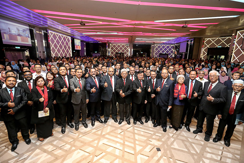 Penang Chief Minister Chow Kon Yeow poses for photos with state excos during a monthy assembly with state civil servants in George Town January 7, 2019. u00e2u20acu201d Picture by Sayuti Zainuddin
