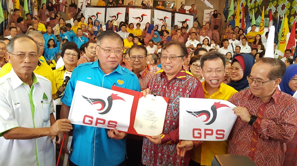 Sarawak Chief Minister Datuk Patinggi Abang Johari Openg with leaders of other GPS component parties holding the logo of GPS coalition in Kuching January 9, 2019. u00e2u20acu201d Picture by Sulok Tawie