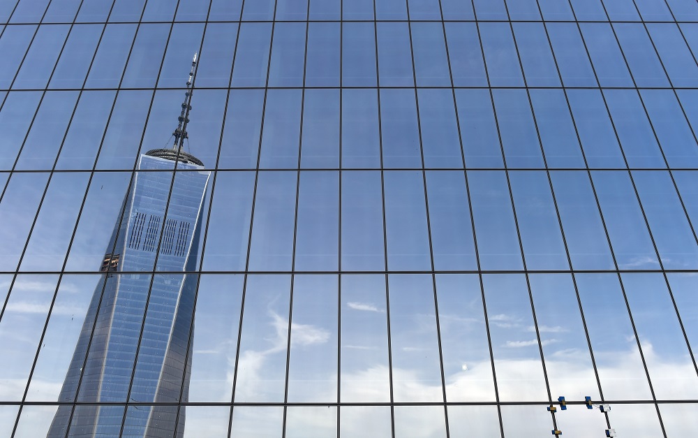 One WTC is reflected in the side of 4 WTC (World Trade Centre). u00e2u20acu201d AFP pic