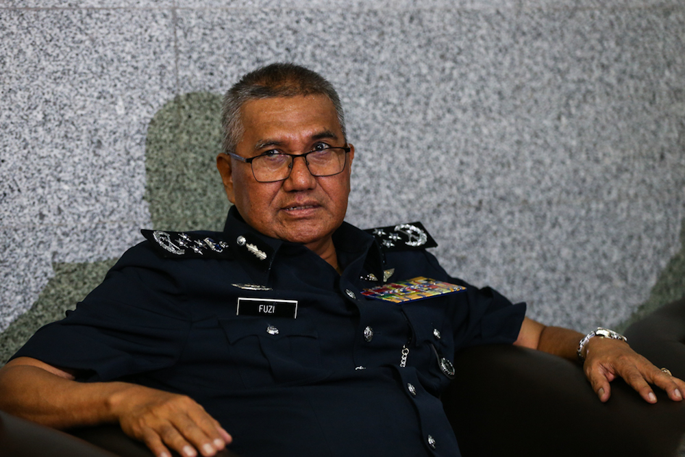 Tan Sri Mohamad Fuzi Harun speaks to reporters after the monthly assembly at Bukit Aman in Kuala Lumpur January 16, 2019. u00e2u20acu201d Picture by Ahmad Zamzahuri