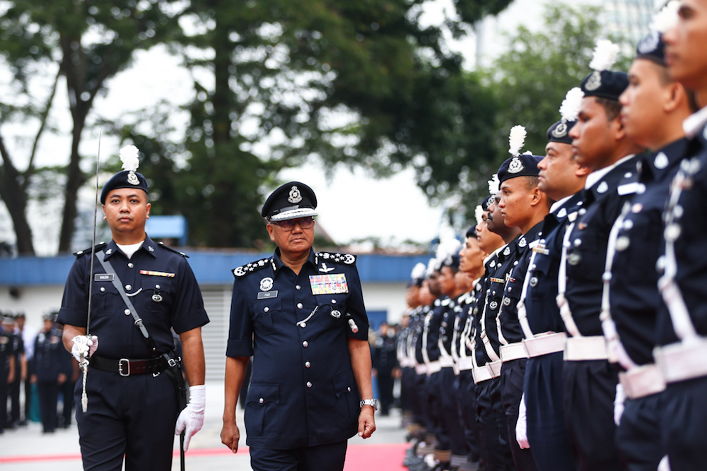 Inspector-General of Police Tan Sri Mohamad Fuzi Harun inspects the guard of honour during the monthly assembly at Bukit Aman in Kuala Lumpur January 16, 2019. u00e2u20acu201d Picture by Ahmad Zamzahuri