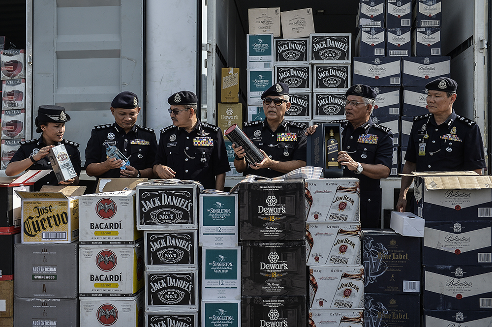 Some of the branded liquor bottles seized during the raid are seen during a police press conference in Bukit Jalil January 21, 2019. u00e2u20acu201d Picture by Miera Zulyana