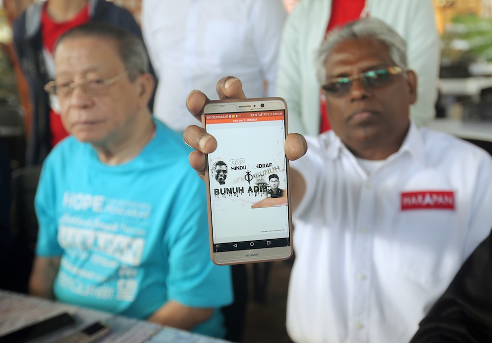 Pakatan Harapanu00e2u20acu2122s Cameron Highlands by-election candidate M. Manogaran shows a poster thatu00e2u20acu2122s being circulated via social media. u00e2u20acu201d Picture by Farhan Najib