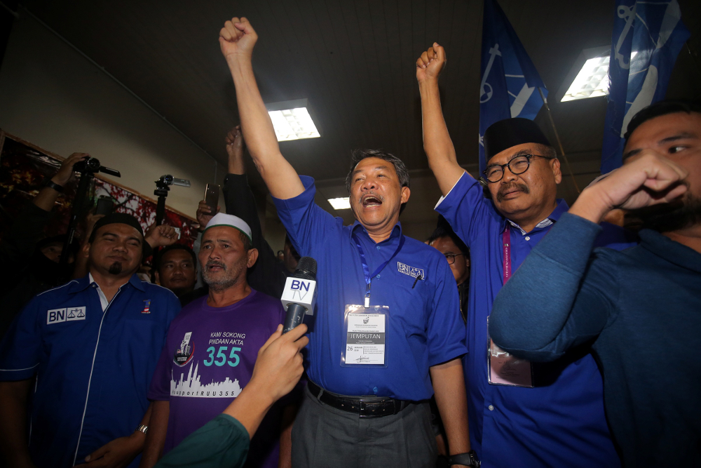 Barisan Nasional chairman Mohamad Hasan together with candidate Ramli Mohd Nor after winning the Cameron Highlands parliamentary seat January 26, 2019. u00e2u20acu201d Picture by Farhan Najib  