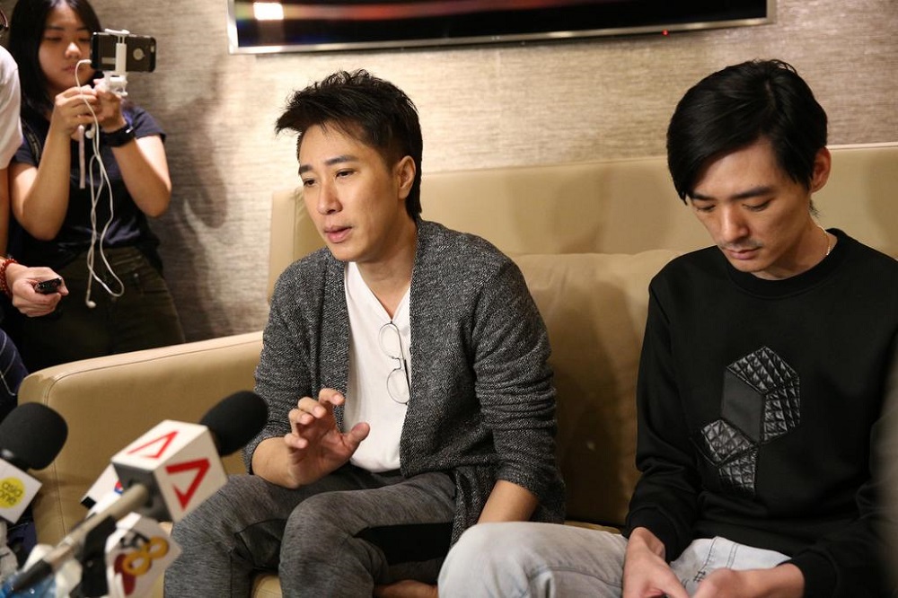 Dasmond Koh (left), mentor to the late actor Aloysius Pang, and Pangu00e2u20acu2122s older brother Kenny speaking to the media at Changi Airport. u00e2u20acu201d TODAY pic