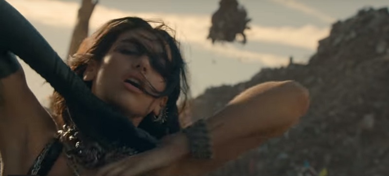 In the accompanying cinematic video for 'Swan Song', Dua Lipa appears on the streets of Iron City in the world of Alita. u00e2u20acu201d Screen capture via YouTube/Dua Lipa