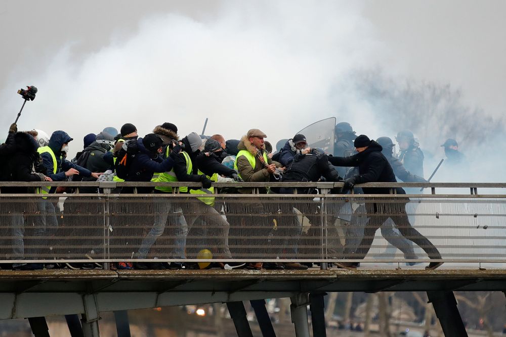 Former French boxing champion, Christophe Dettinger (right), is seen during clashes with French Gendarmes at a demonstration by the u00e2u20acu02dcyellow vestsu00e2u20acu2122 on the passerelle Leopold-Sedar-Senghor bridge in Paris, January 5, 2019. u00e2u20acu201d Reuters pic