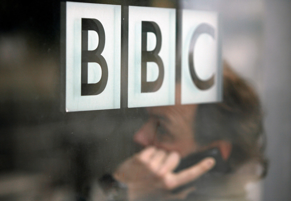 A man talks on a mobile phone inside the BBC headquarters in London, Britain November 21, 2008. u00e2u20acu201d Reuters pic